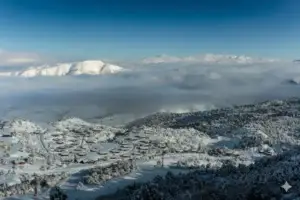 Mountains with snow-capped peaks and houses