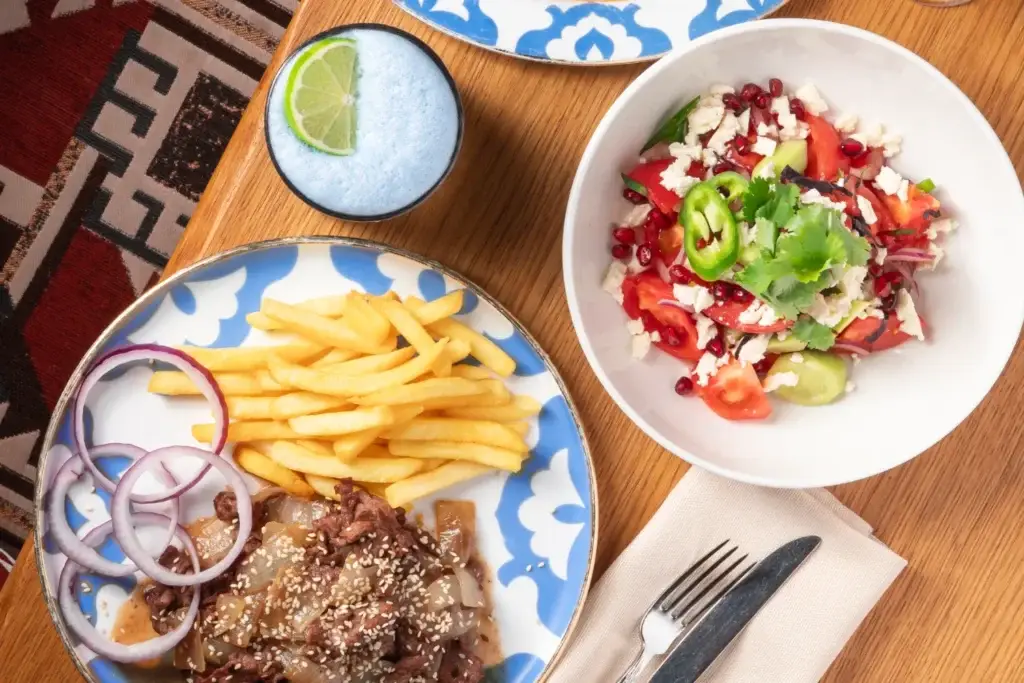 Oriental Dastarkhan Lali set - dolma in tomato sauce, Choban salad with homemade cheese, beef sumboro with potatoes