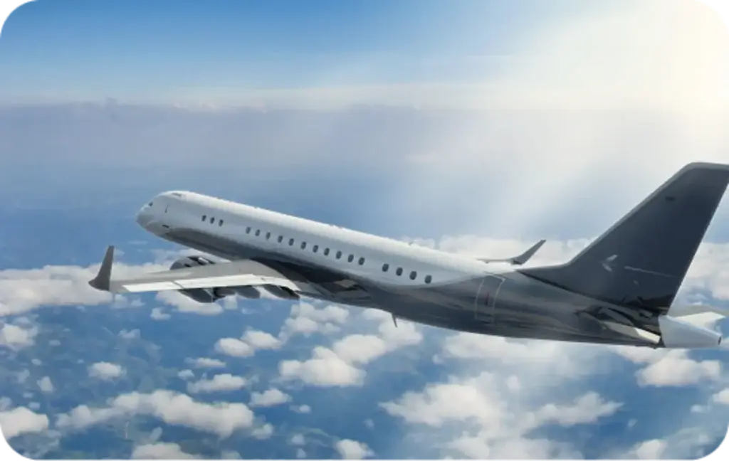 A private jet flying above the clouds