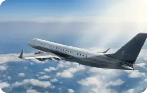 A private jet flying above the clouds