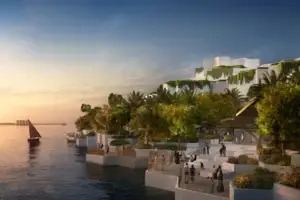 Modern terraced waterfront with lush greenery and people along the coastline at sunset