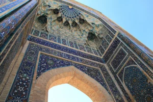 Ornate architectural entrance of the Gur-e-Amir Mausoleum in Samarkand, Uzbekistan