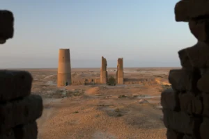 Ruins of the ancient city of Dehistan/Mishrian in Turkmenistan featuring two minarets and mosque remnants in a desert landscape